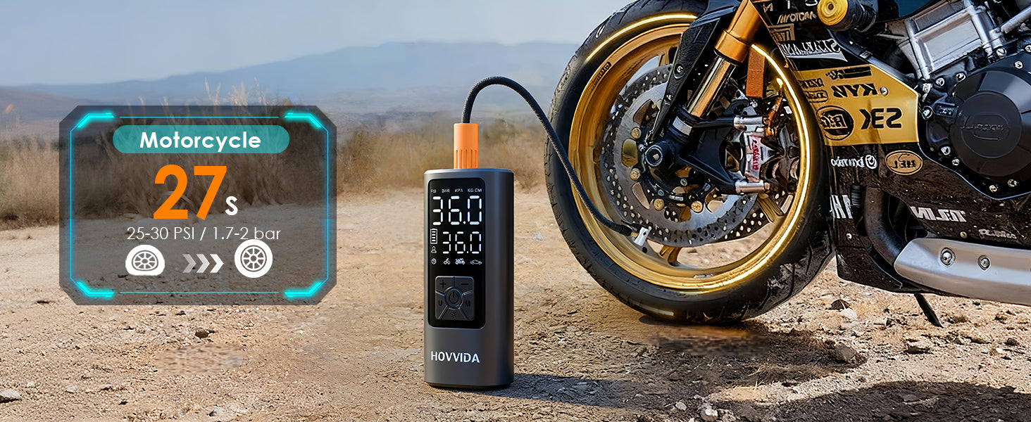 Motorcycle tire inflator with digital display next to a motorcycle on a dirt road.