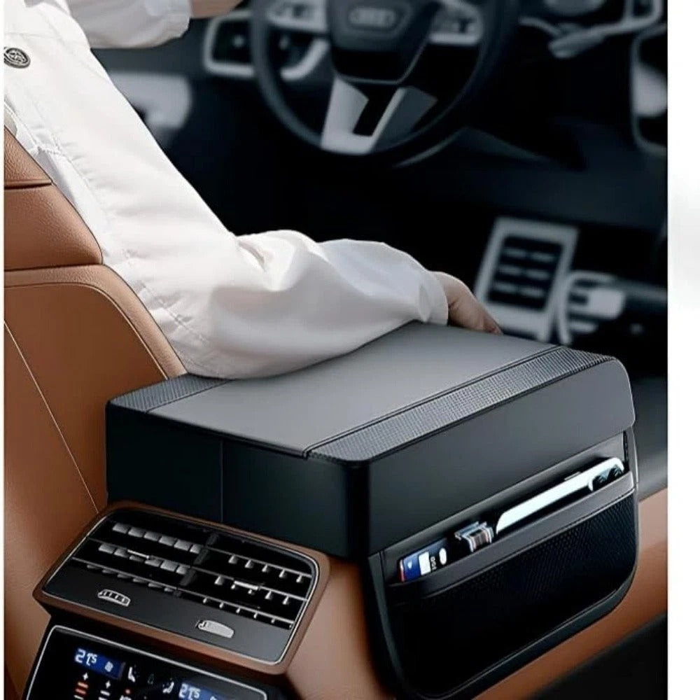 Car console with cup holder and smartphone stand, Audi logo visible