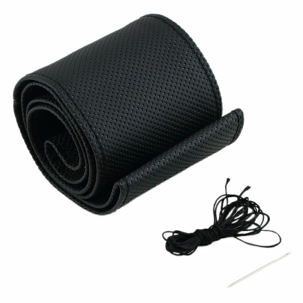 Black textured mat with a string and needle on a white background